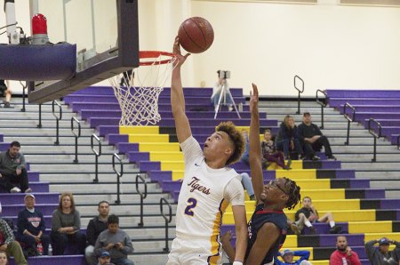 Jayden Bray-Williams goes for two in Wednesday's season opener in the Lemoore High School Event Center.